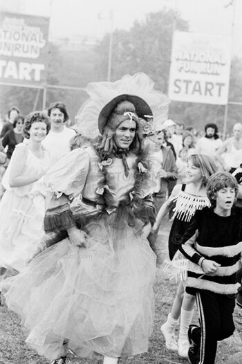 Male runner dressed in female clothing participating in the Sunday Times National Fun Run event. Hyde Park, London, Sunday, 28 September 1980.