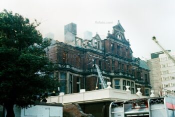 Fire fighters on long ladders tackle the fire at the Esplanade Hotel Fire, Penarth, South Wales 1977