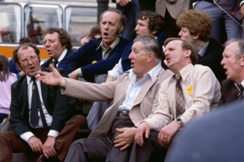 Several members of Risca Male Voice Choir from South Wales, UK. Public singing on steps of Anteros statue (also known as Eros) Piccadilly Circus, London, 1980.
