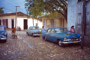 Camaguey town, Cuba. Street scene showing old vintage vehicle. 1997.