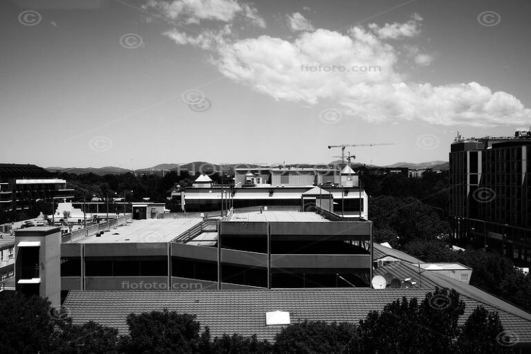 View of the Canberra cityscape, Australia, with rooftops in Dickson and the distant hills of Mount Ainslie.