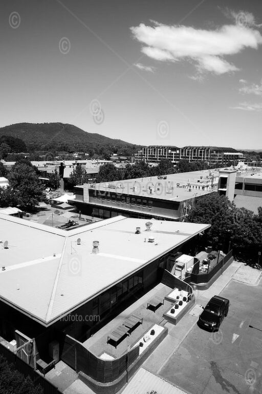 View of the Canberra cityscape, Australia, with rooftops in Dickson and the distant hills of Mount Ainslie.