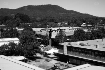 Canberra cityscape and topographics, Australia. View over rooftops in Dickson towards the hills at Mount Ainslie in the south east, ACT, Australia.
