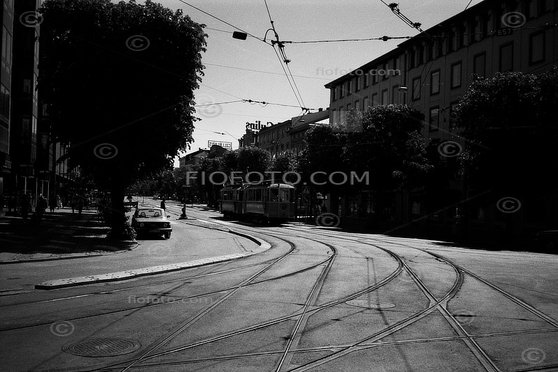 Street views around central Gothenburg, Sweden. Image shows tram and tram lines on urban road. Photo circa 1985.