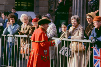 The Town Crier, also known as the Bell Man, speaking with a crowd along the Lord Mayor's Show procession route in the City of London.