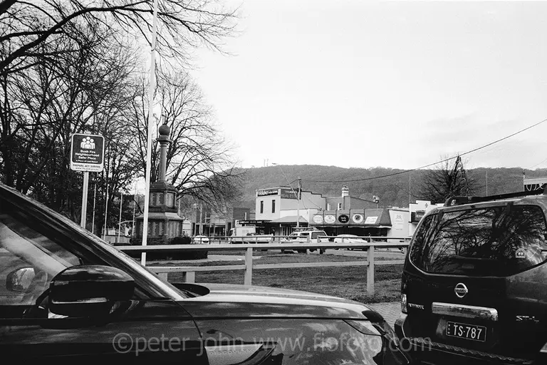 cars, traffic next to bowral war memorial. bowral town, nsw