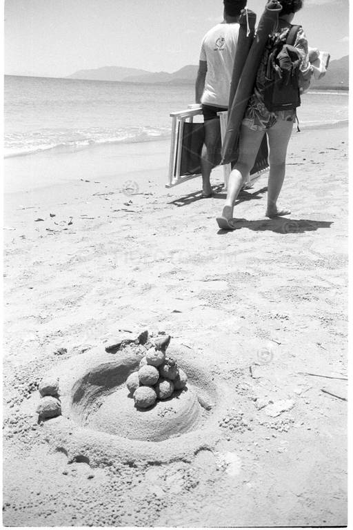 Small sand sculpture on beach. Port Douglas, Queensland, Australia