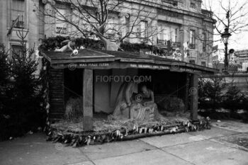 Public Christmas nativity display in London's Trafalgar Square, bearing the words 'The word was made flesh, full of grace and truth'. November 1979
