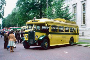 Yellow and green Vanguard bus. Antique, vintage public transport vehicle showing route destination Swansea. Display of vintage transport vehicles near Cardiff City Hall, Cardiff, South Wales. An event as part of the Queens' Silver Jubilee celebrations. Photo July 1977